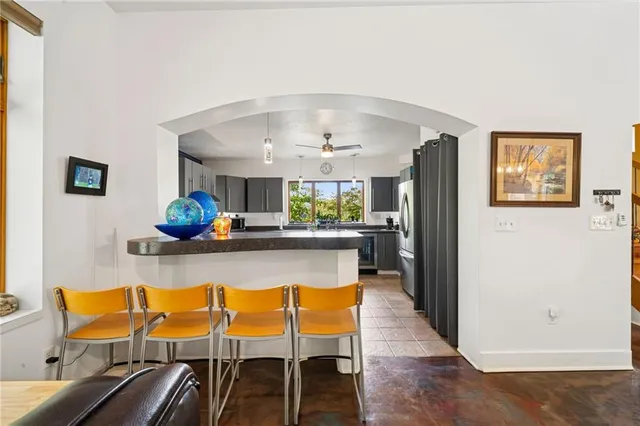 a dining room with furniture and a window