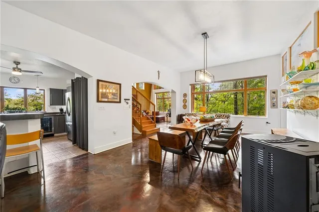 a view of a dining room with furniture window and outside view