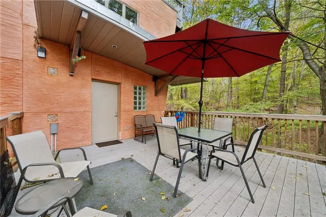 a patio with a patio table and chairs