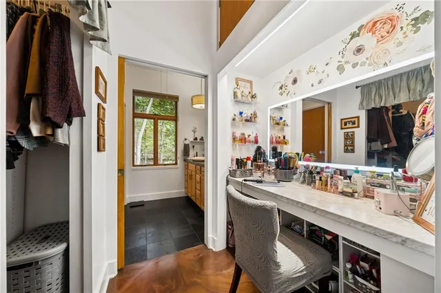 a bathroom with a sink a mirror and a bath tub