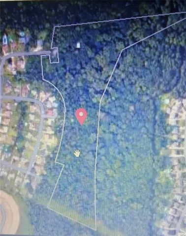 a view of a lake with a yard