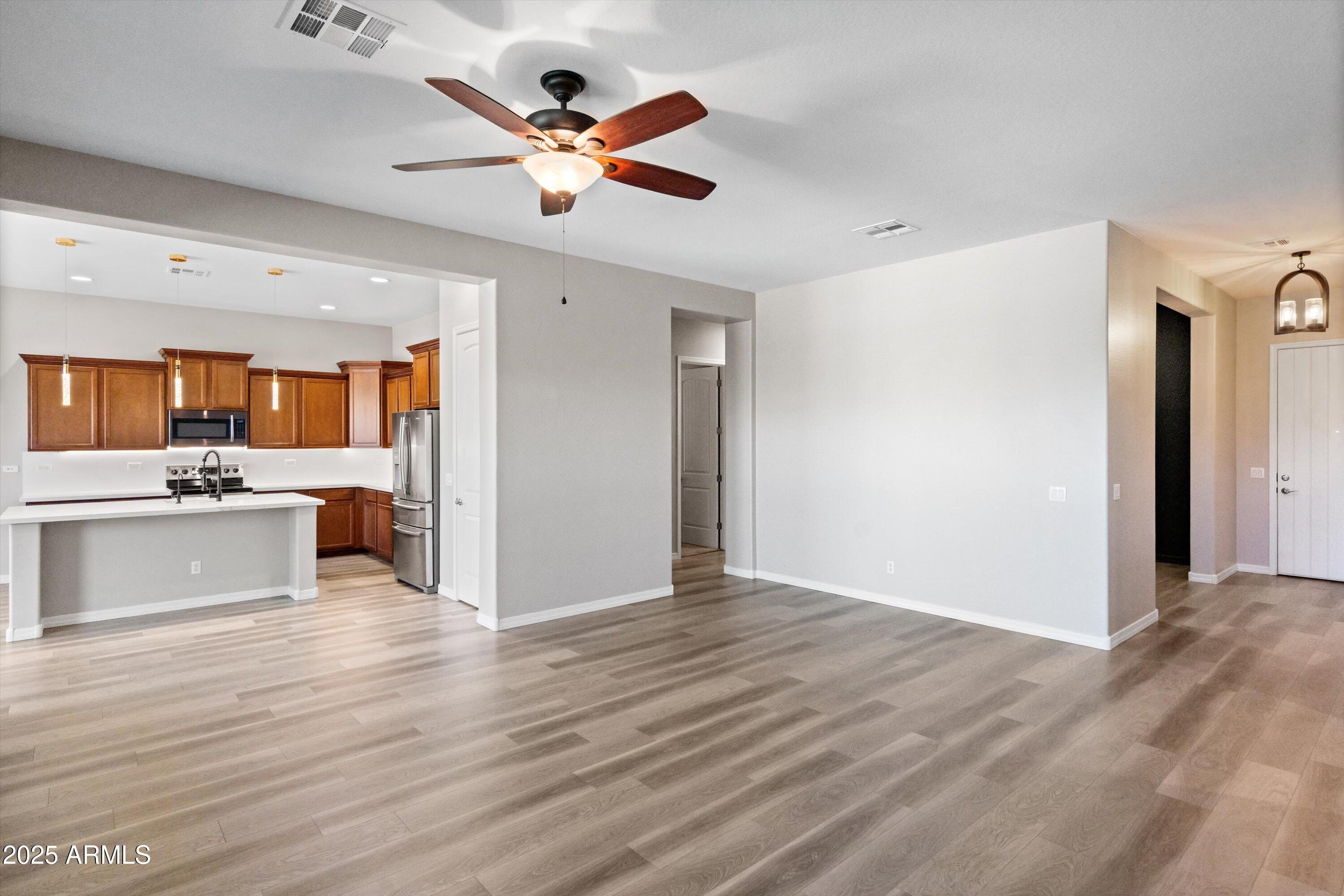 20486 West Ridge Road Buckeye, AZ 85396 - Photo 14 of 100 Family Room to Kitchen