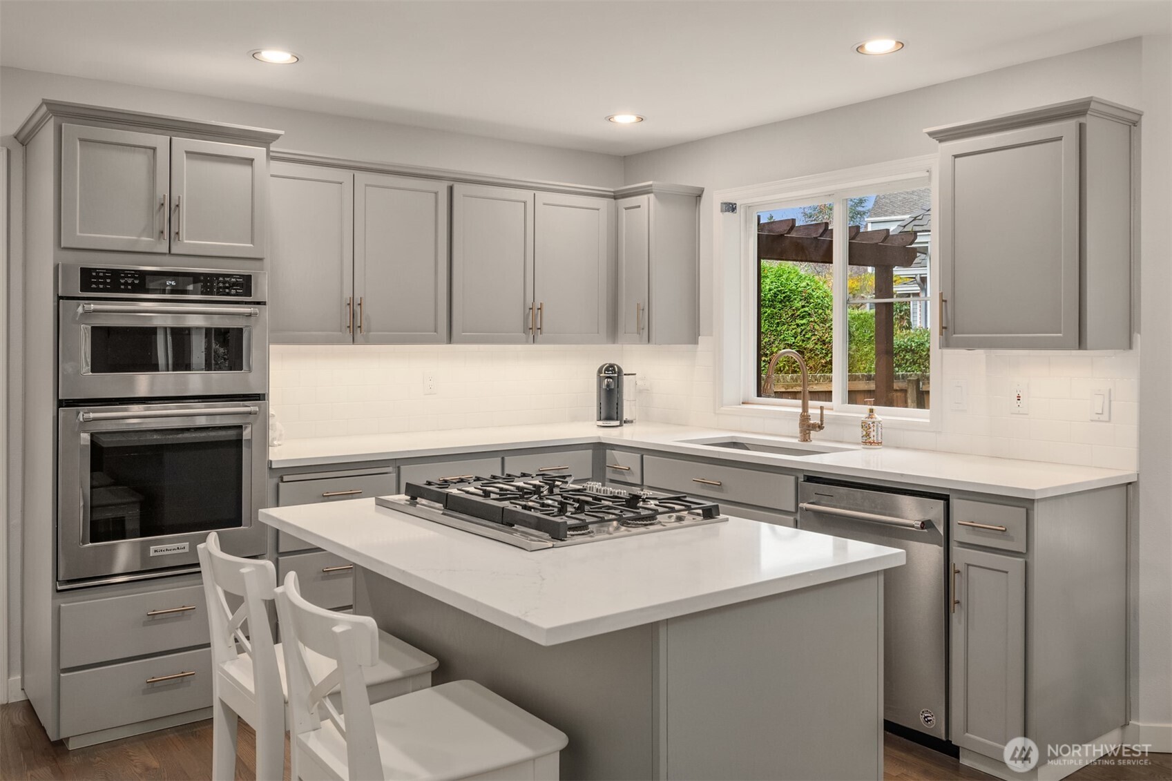 10330 Northeast 151st Place Bothell, WA 98011 - Photo 15 of 38 a kitchen with a sink stove and microwave