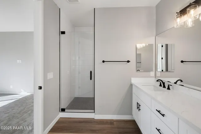 a bathroom with a sink and a shower