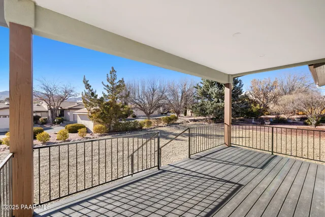 a view of a balcony with wooden floor