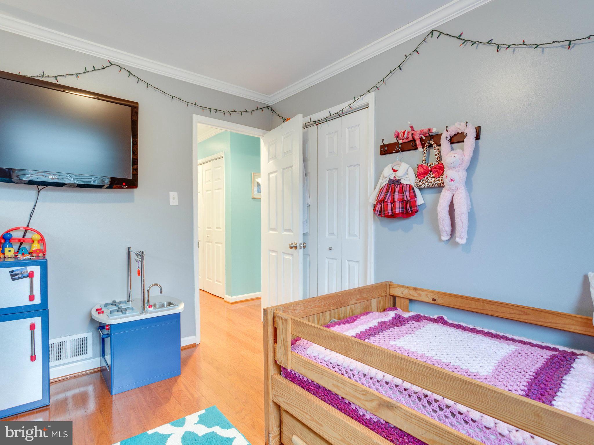 5303 Inverchapel Road Springfield, VA 22151 - Photo 12 of 18 a bedroom with a bed and a flat screen tv