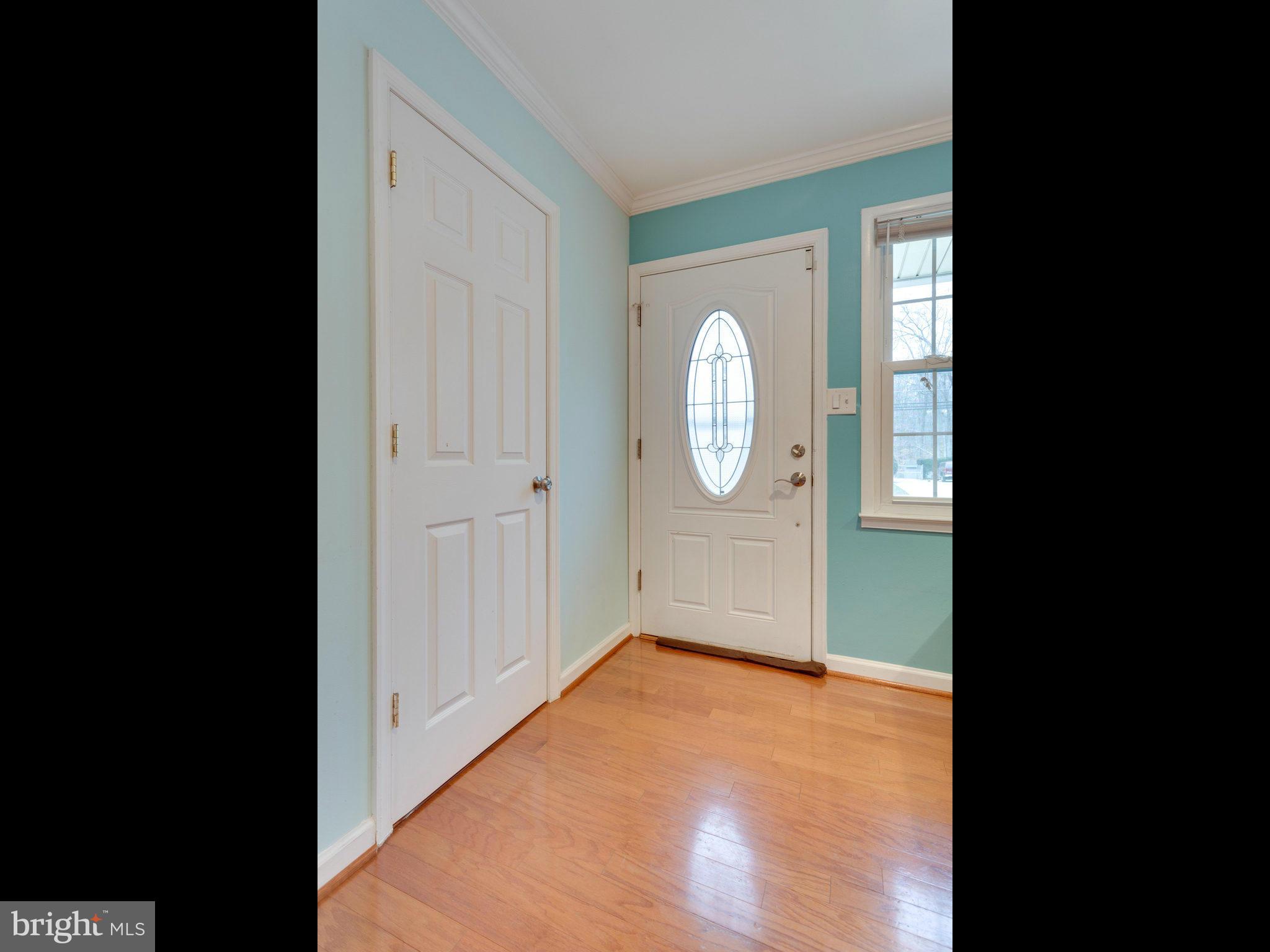 5303 Inverchapel Road Springfield, VA 22151 - Photo 3 of 18 a view of a room with wooden floor and mirror