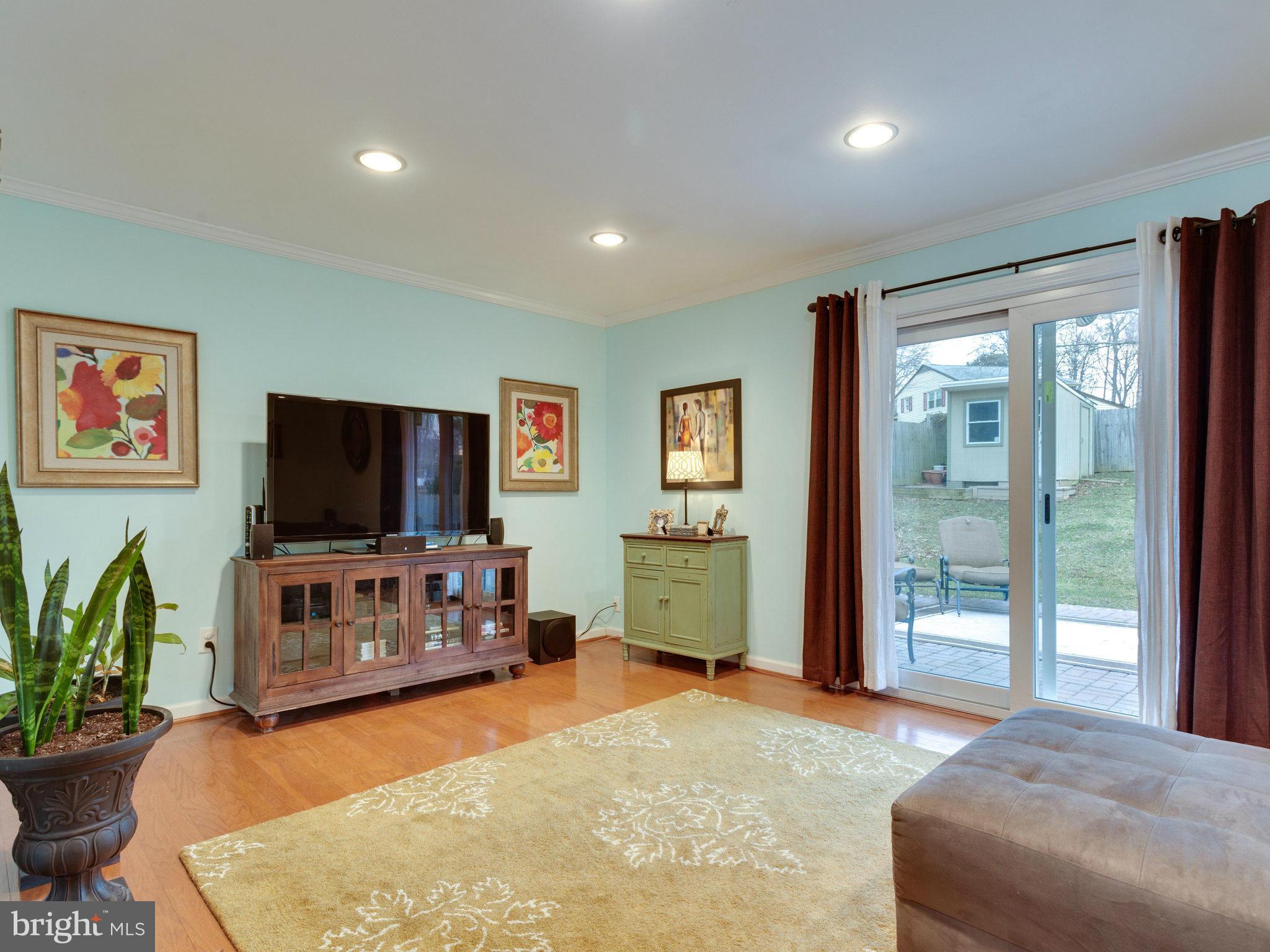 5303 Inverchapel Road Springfield, VA 22151 - Photo 4 of 18 a bedroom with furniture and a flat screen tv