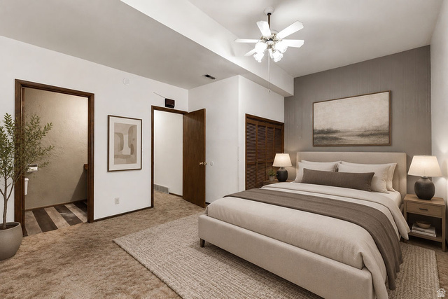 299 West Center Street, Unit 2 Logan, UT 84321 - Photo 17 of 46 Bedroom featuring a textured accent wall, ceiling fan, and carpeted flooring