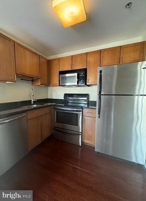 3750 Main Street, Unit 509 Philadelphia, PA 19127 - Photo 11 of 23 a kitchen with a refrigerator and a stove top oven