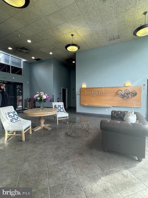 3750 Main Street, Unit 509 Philadelphia, PA 19127 - Photo 4 of 23 a living room with furniture and a potted plant