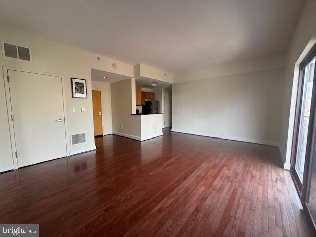 3750 Main Street, Unit 509 Philadelphia, PA 19127 - Photo 5 of 23 an empty room with wooden floor and windows