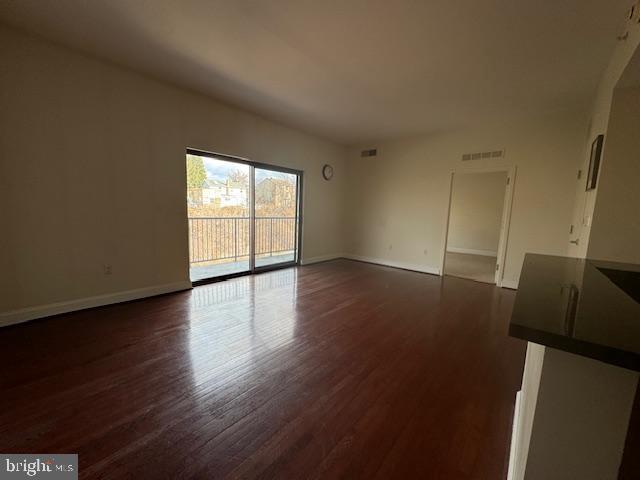 3750 Main Street, Unit 509 Philadelphia, PA 19127 - Photo 6 of 23 an empty room with wooden floor and windows