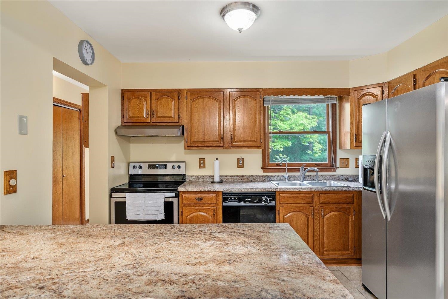 592 Stover Shop Road Churchville, VA 24421 - Photo 12 of 36 a kitchen with stainless steel appliances granite countertop a refrigerator a stove a sink and dishwasher