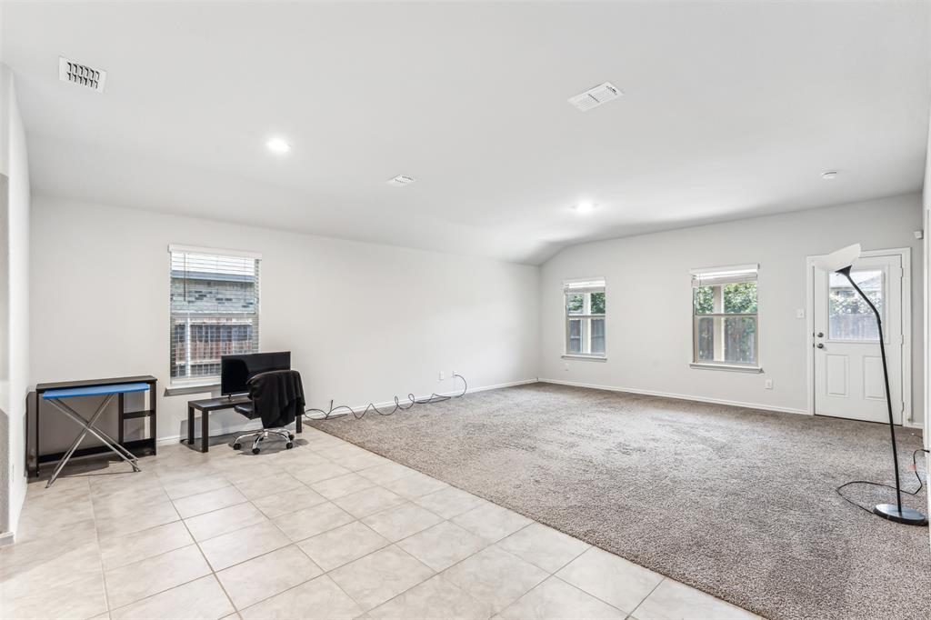 714 Wolf Creek Cleburne, TX 76033 - Photo 22 of 40 a view of a workspace with furniture and a window