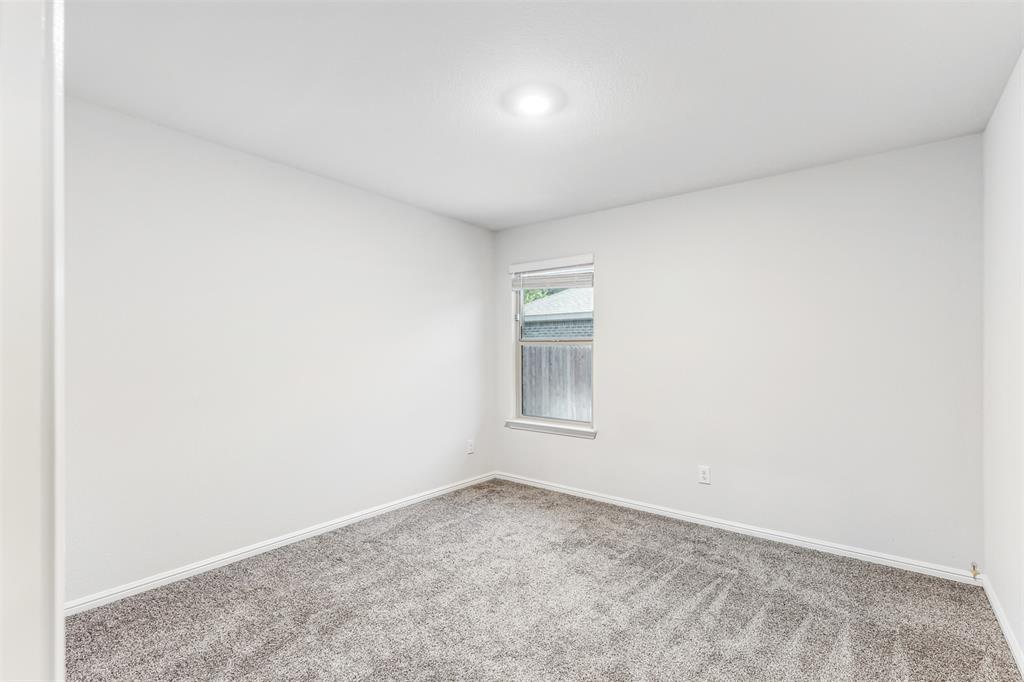 714 Wolf Creek Cleburne, TX 76033 - Photo 25 of 40 an empty room with a empty space and windows