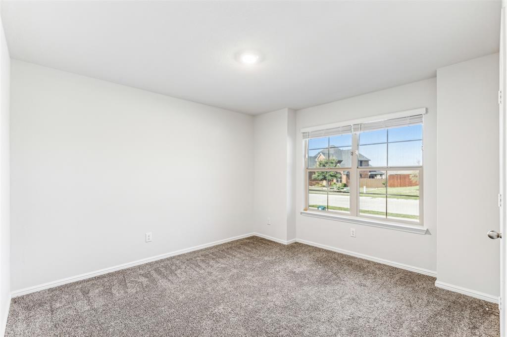 714 Wolf Creek Cleburne, TX 76033 - Photo 36 of 40 an empty room with windows