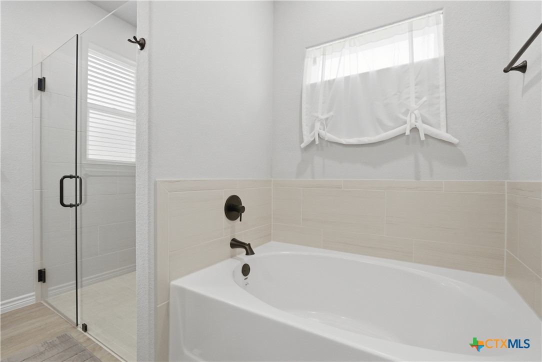 3201 Hedwig Street Killeen, TX 76549 - Photo 20 of 38 a bathroom with a tub and a shower