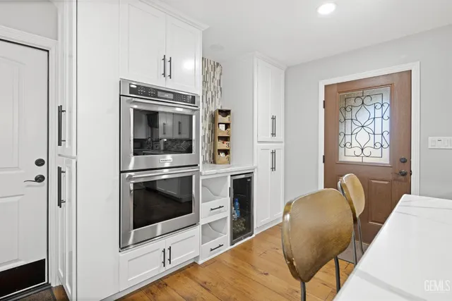 a kitchen with stainless steel appliances a stove a microwave and a refrigerator