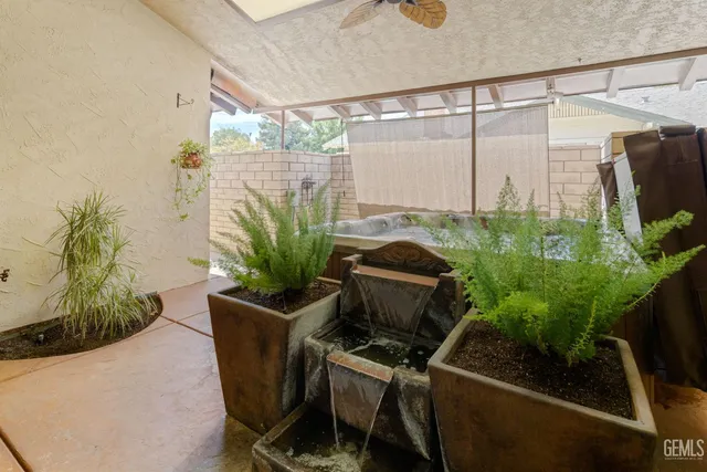 a spacious bedroom with a large bed and a large window