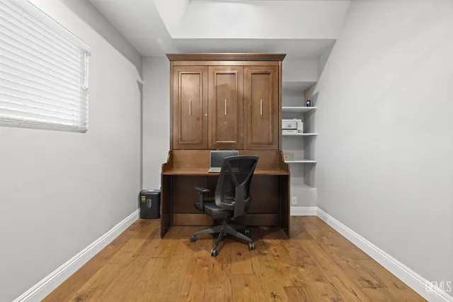 a bedroom with a bed and a mirror