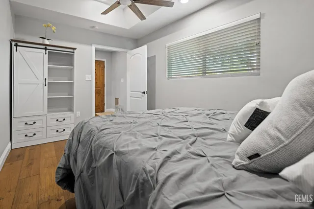 a view of workspace with wooden floor and windows