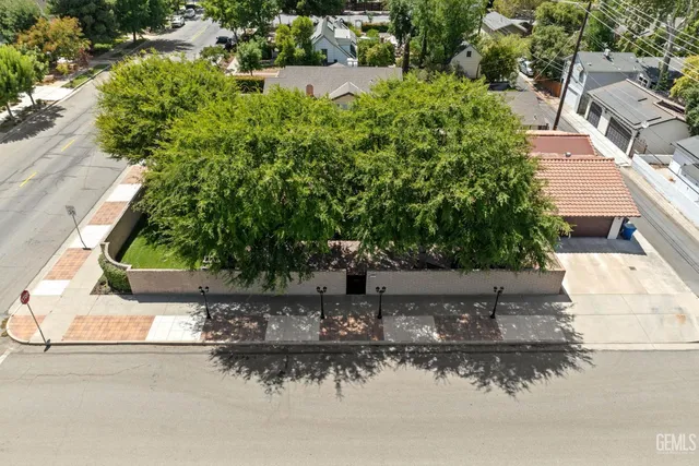 an aerial view of a house with a yard