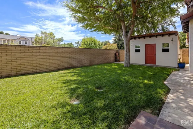 a backyard of a house with seating space