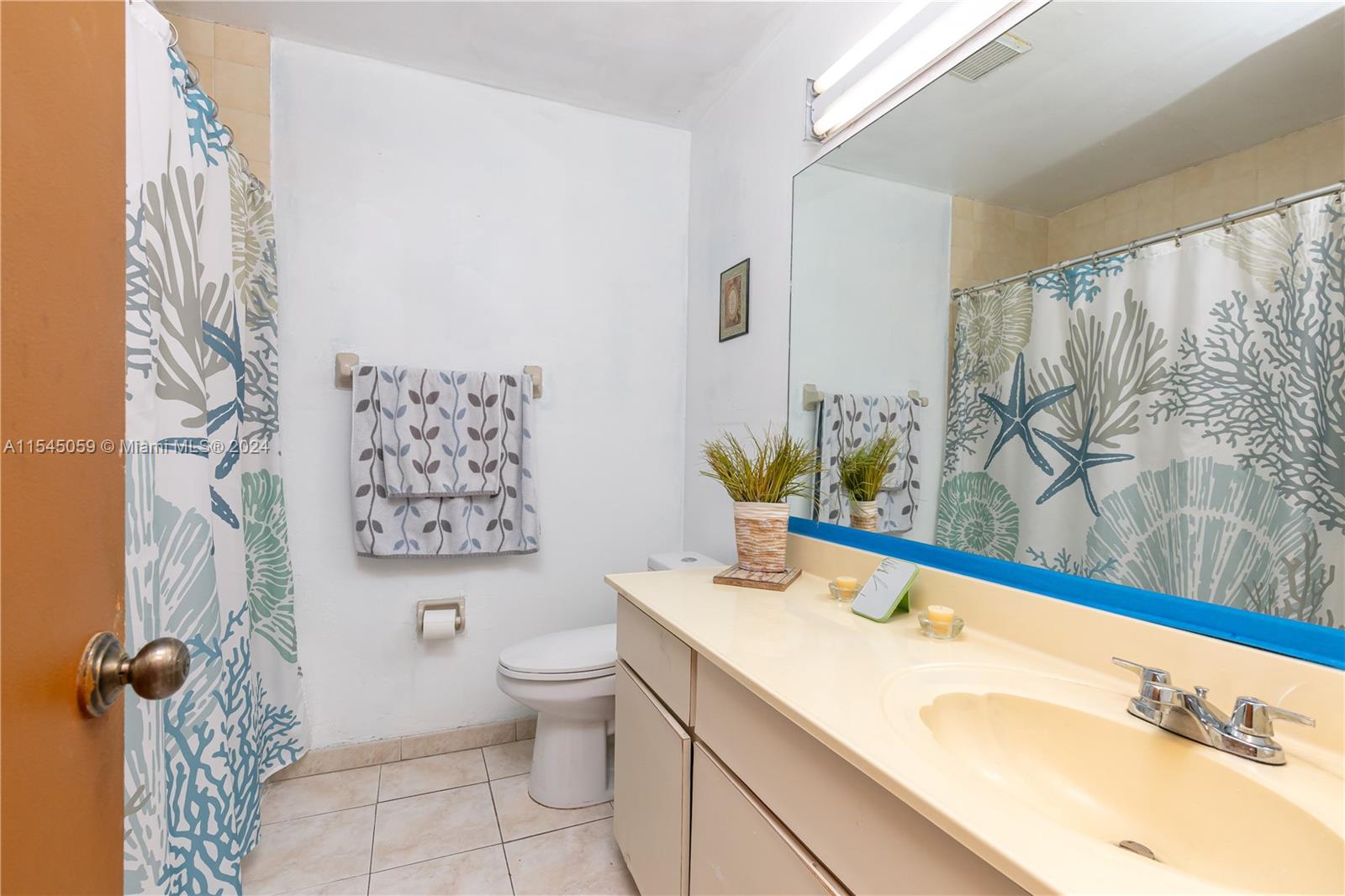1490 Southwest 124th Pl Concourse Miami, FL 33184 - Photo 13 of 16 a bathroom with a sink toilet and shower