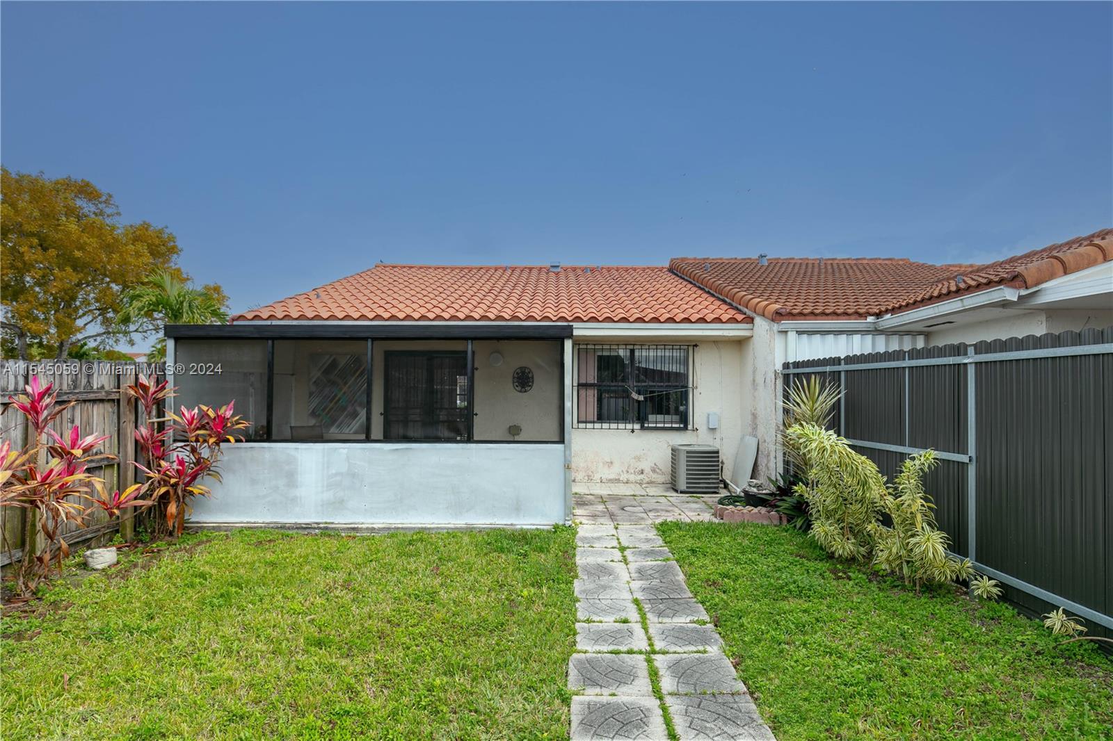 1490 Southwest 124th Pl Concourse Miami, FL 33184 - Photo 16 of 16 a front view of a house with garden