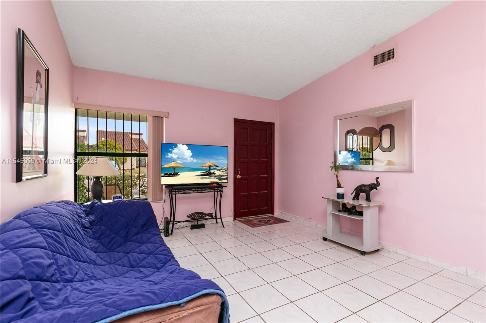 1490 Southwest 124th Pl Concourse Miami, FL 33184 - Photo 5 of 16 a living room with furniture and a window