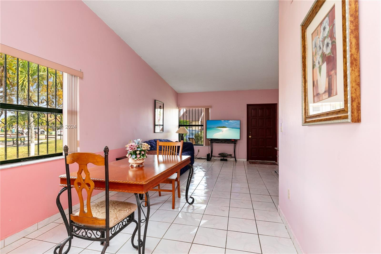 1490 Southwest 124th Pl Concourse Miami, FL 33184 - Photo 6 of 16 a dining room with furniture and window