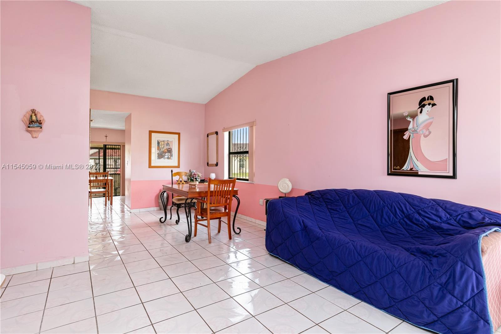 1490 Southwest 124th Pl Concourse Miami, FL 33184 - Photo 7 of 16 a living room with furniture and a dining table