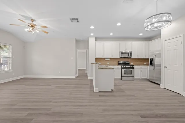 a view of house with large windows