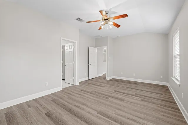 a view of kitchen with sink microwave and refrigerator