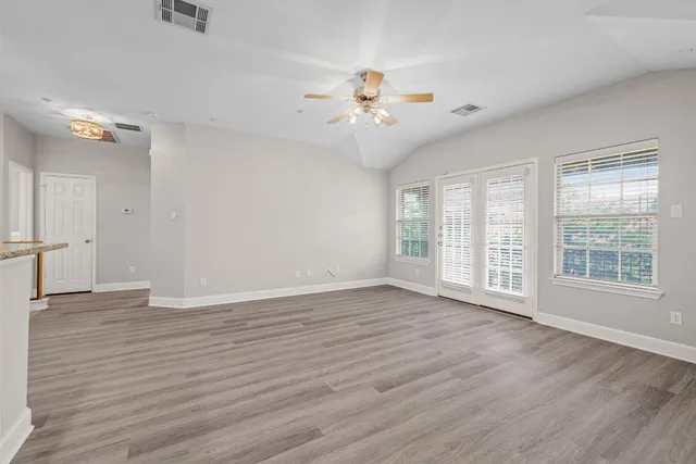 a view of balcony with wooden floor