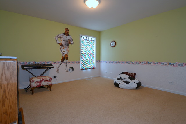 756 Ridge Drive Elburn, IL 60119 - Photo 14 of 18 a room with toys and wooden floor