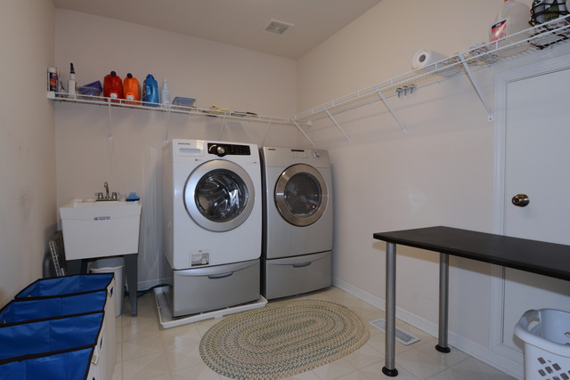 756 Ridge Drive Elburn, IL 60119 - Photo 16 of 18 a utility room with dryer and washer