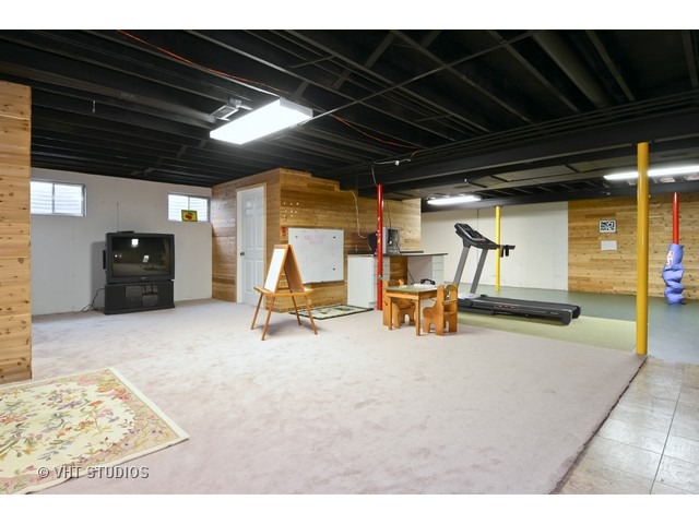 756 Ridge Drive Elburn, IL 60119 - Photo 7 of 18 a view of a room with wooden floor
