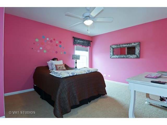 756 Ridge Drive Elburn, IL 60119 - Photo 9 of 18 a bedroom with a bed and a dresser