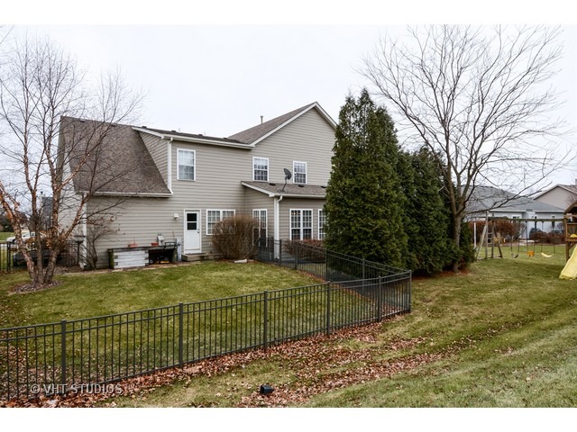 756 Ridge Drive Elburn, IL 60119 - Photo 10 of 18 a view of a house with a back yard