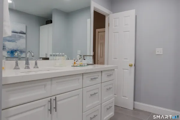 a bathroom with a sink and a mirror
