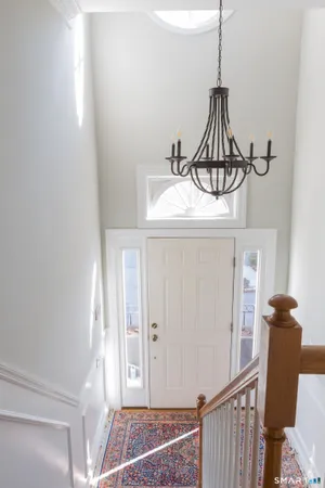 a view of a hallway with a chandelier