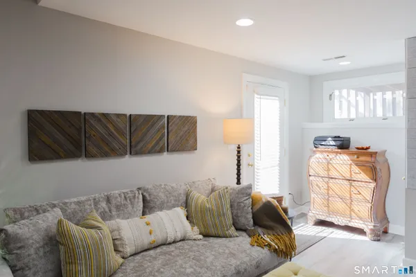 a living room with furniture and a window
