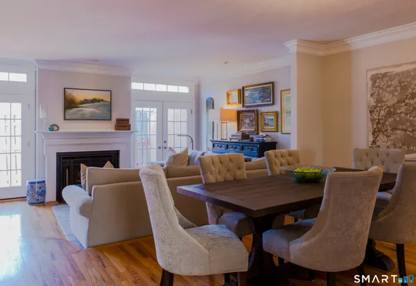 a view of a dining room with furniture window and wooden floor