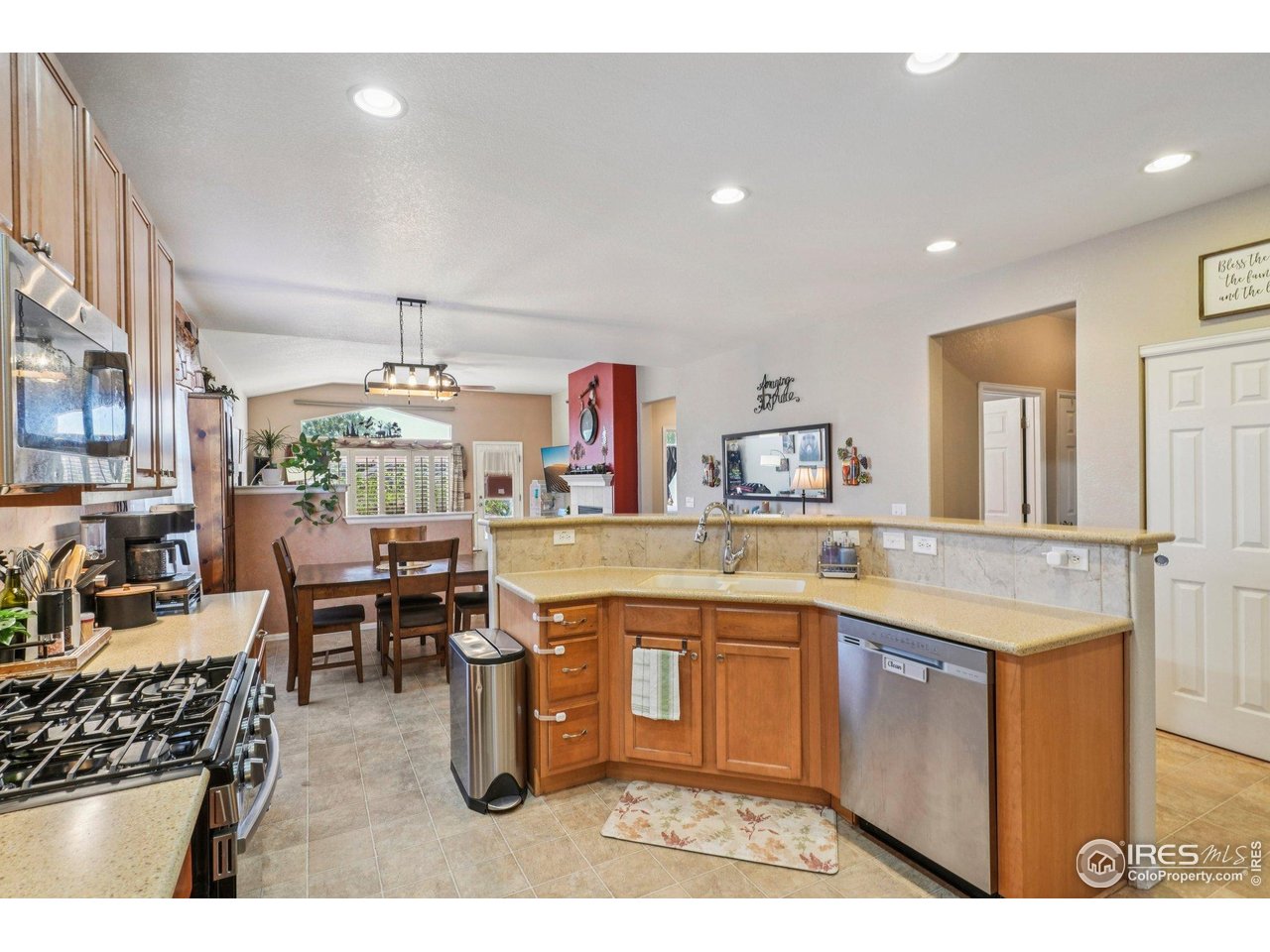 256 Homestead Way Brighton, CO 80601 - Photo 11 of 42 a kitchen with lots of counter top space