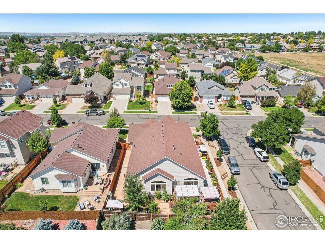 256 Homestead Way Brighton, CO 80601 - Photo 37 of 42 an aerial view of residential houses with outdoor space