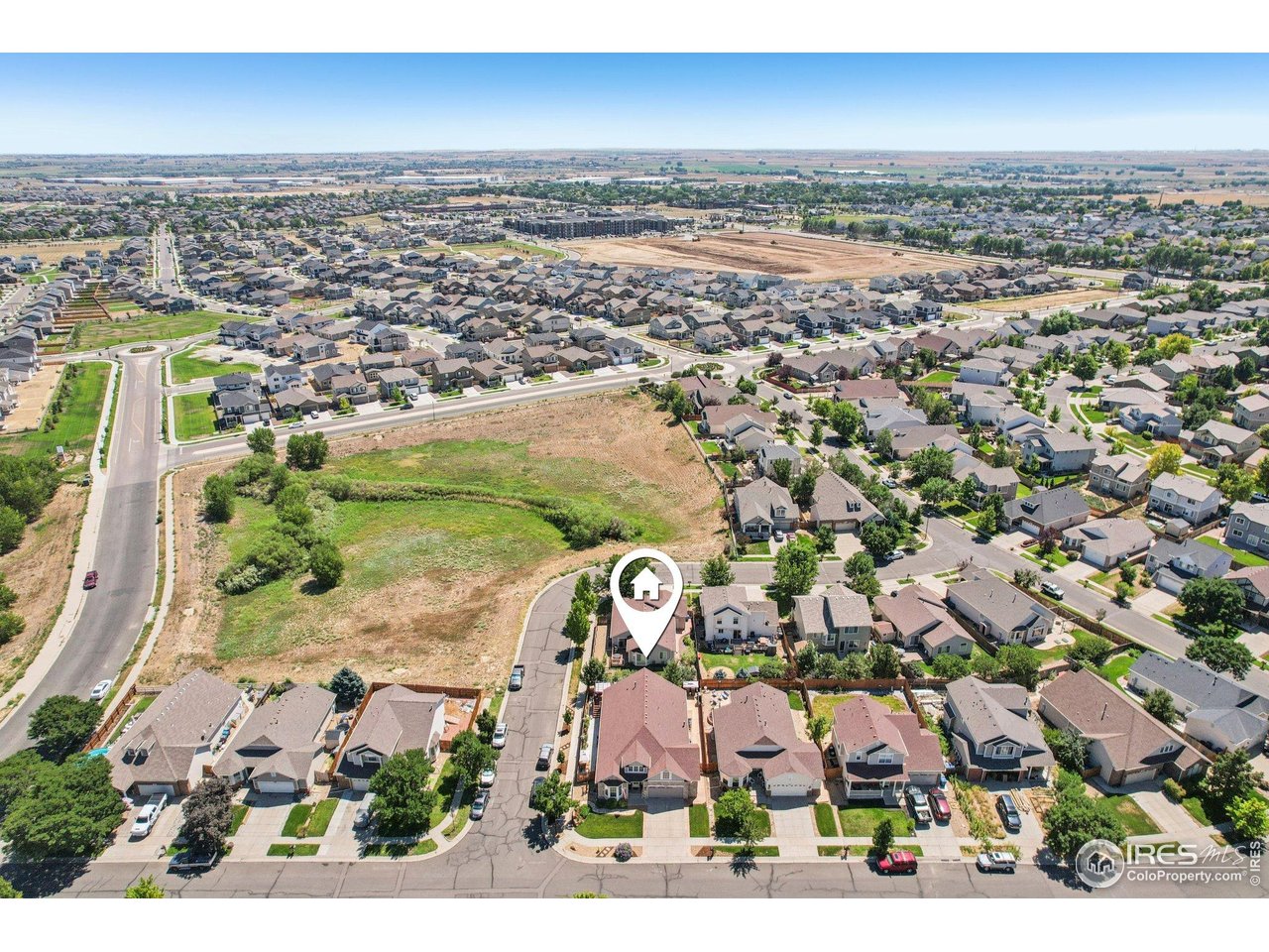 256 Homestead Way Brighton, CO 80601 - Photo 39 of 42 an aerial view of residential houses with outdoor space