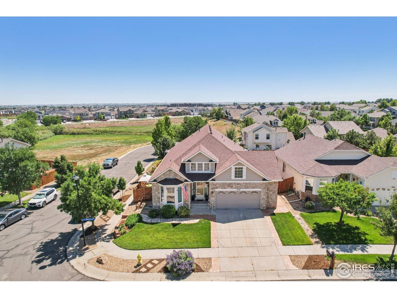 256 Homestead Way Brighton, CO 80601 - Photo 7 of 42 an aerial view of a house with garden space and street view
