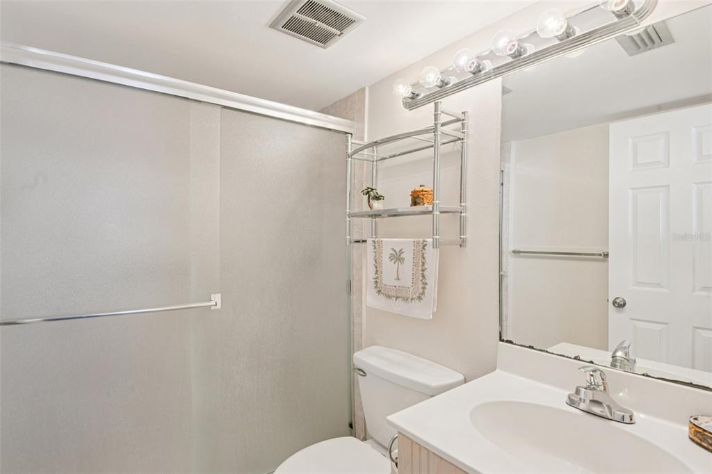 18304 Gulf Boulevard, Unit 607 Redington Shores, FL 33708 - Photo 17 of 30 a bathroom with a sink toilet and shower